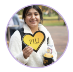 Student with PLU Heart and Cupcake